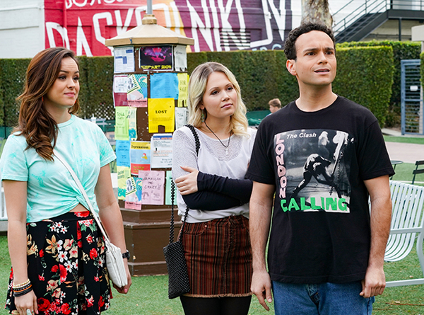 Scene still from the Goldbergs. Erica, Ren, & Barry on college campus