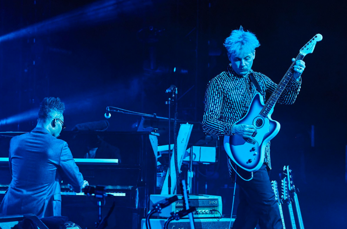 Jack White performing live under blue lights. Photo by David James Swanson