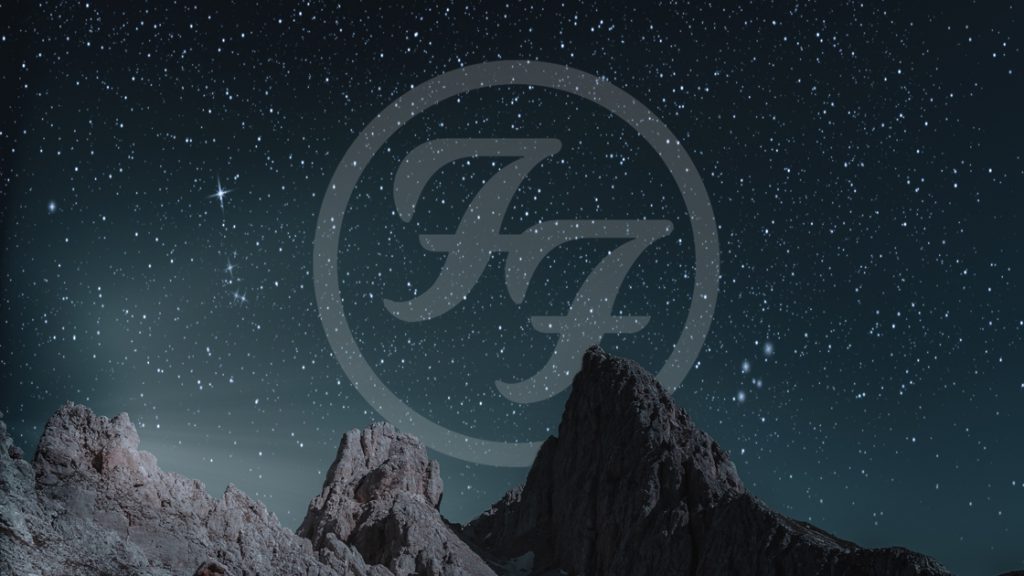 Foo fighters logo in stars above a mountain range.