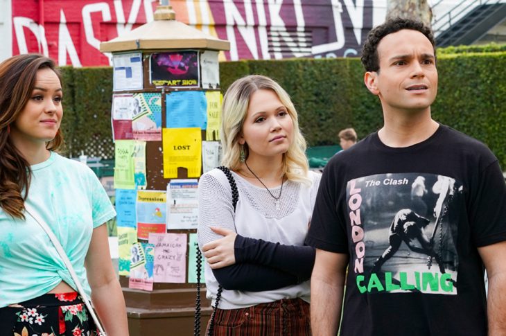 Scene still from the Goldbergs. Erica, Ren, & Barry on college campus