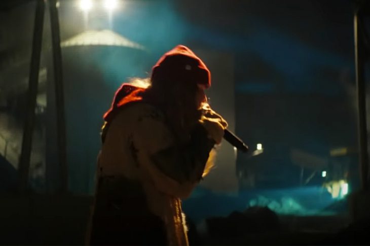 still image from Girl In Red singing in a warehouse.