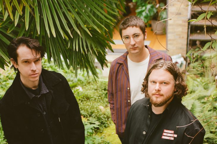Photo of Alt-J band members outside by Rosie Matheson