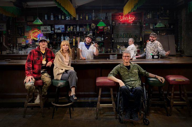 Photo of Portugal The Man band members sitting at a bar. Photo by Henry Ramsey