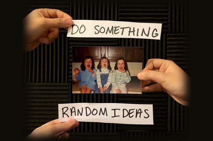 artwork for Do Something by Random Ideas. Three hands holding a picture and text.