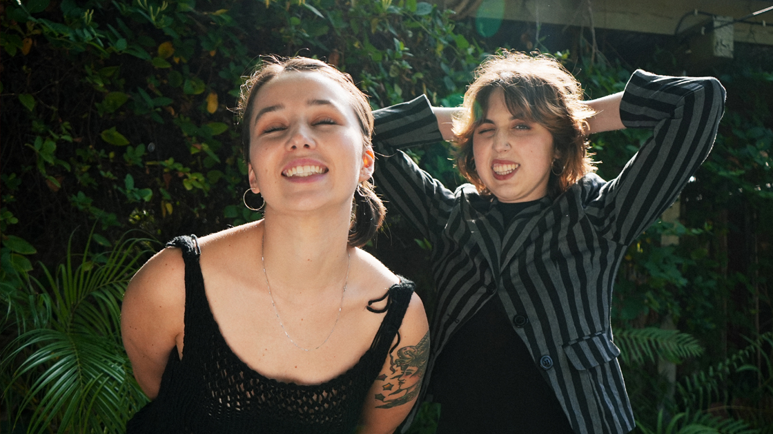 Two women standing outside