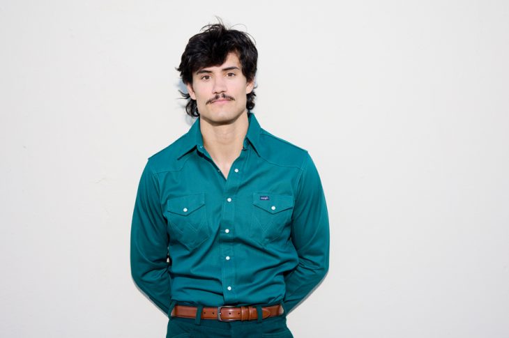 Photo of man with mustache photographed against white background
