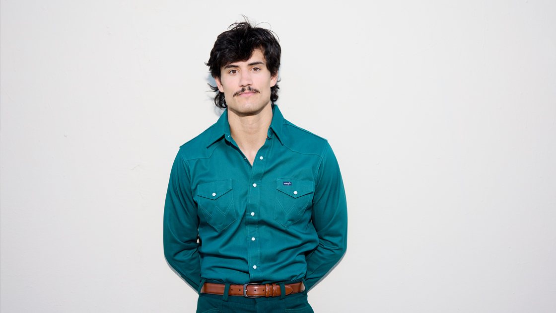 Photo of man with mustache photographed against white background
