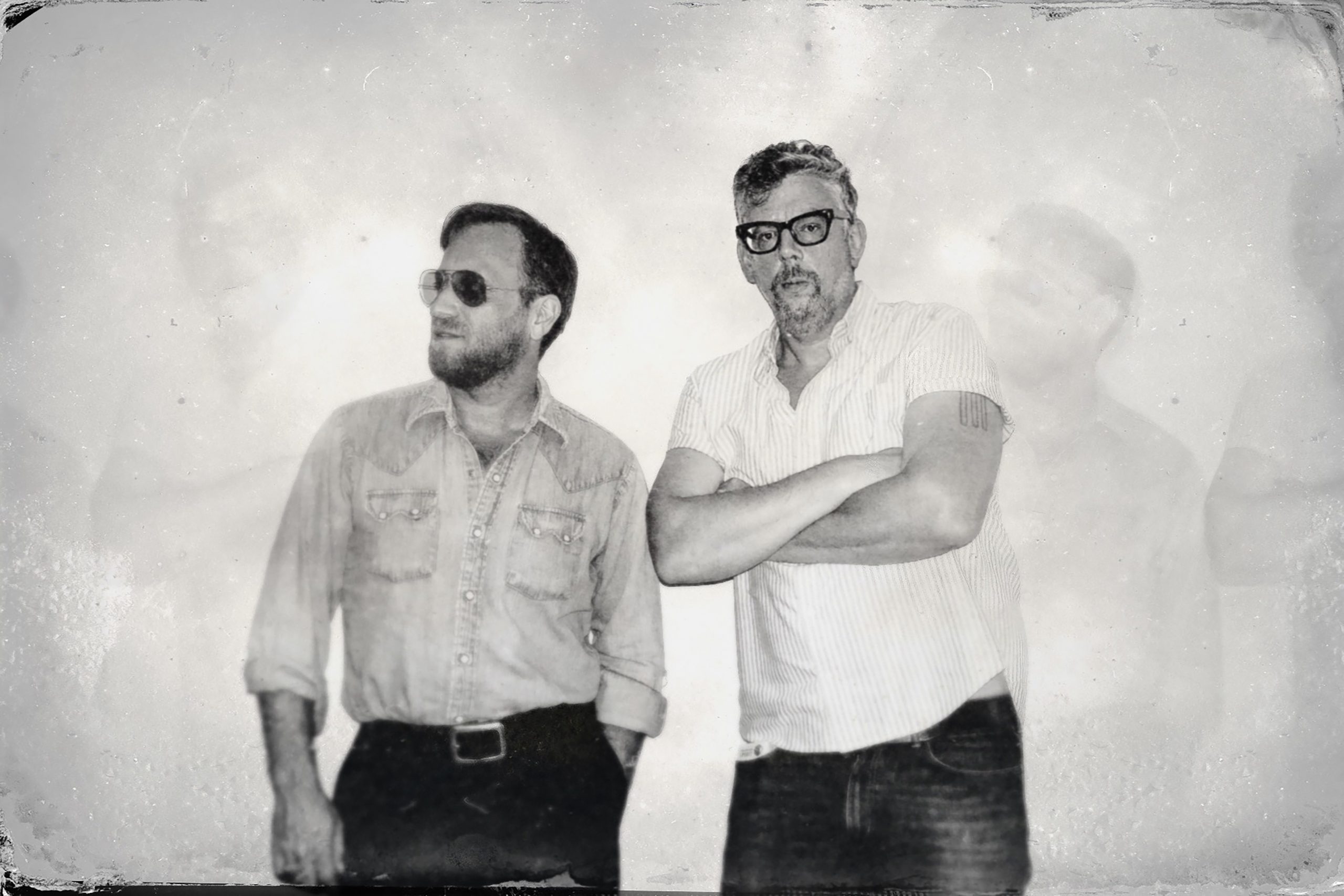 Black and white photograph of two men against white background