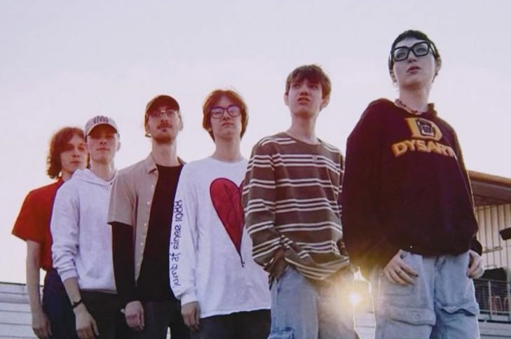 6 people standing in a line