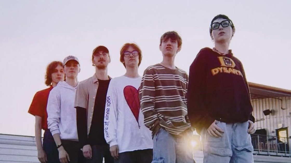 6 people standing in a line
