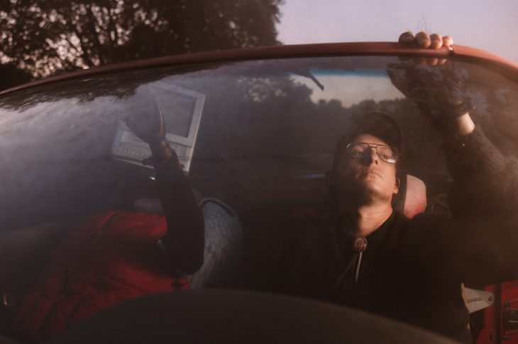 Photo of man sitting in car