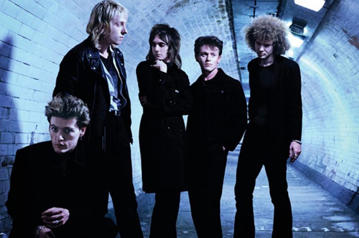 Five men photographed in underground tunnel