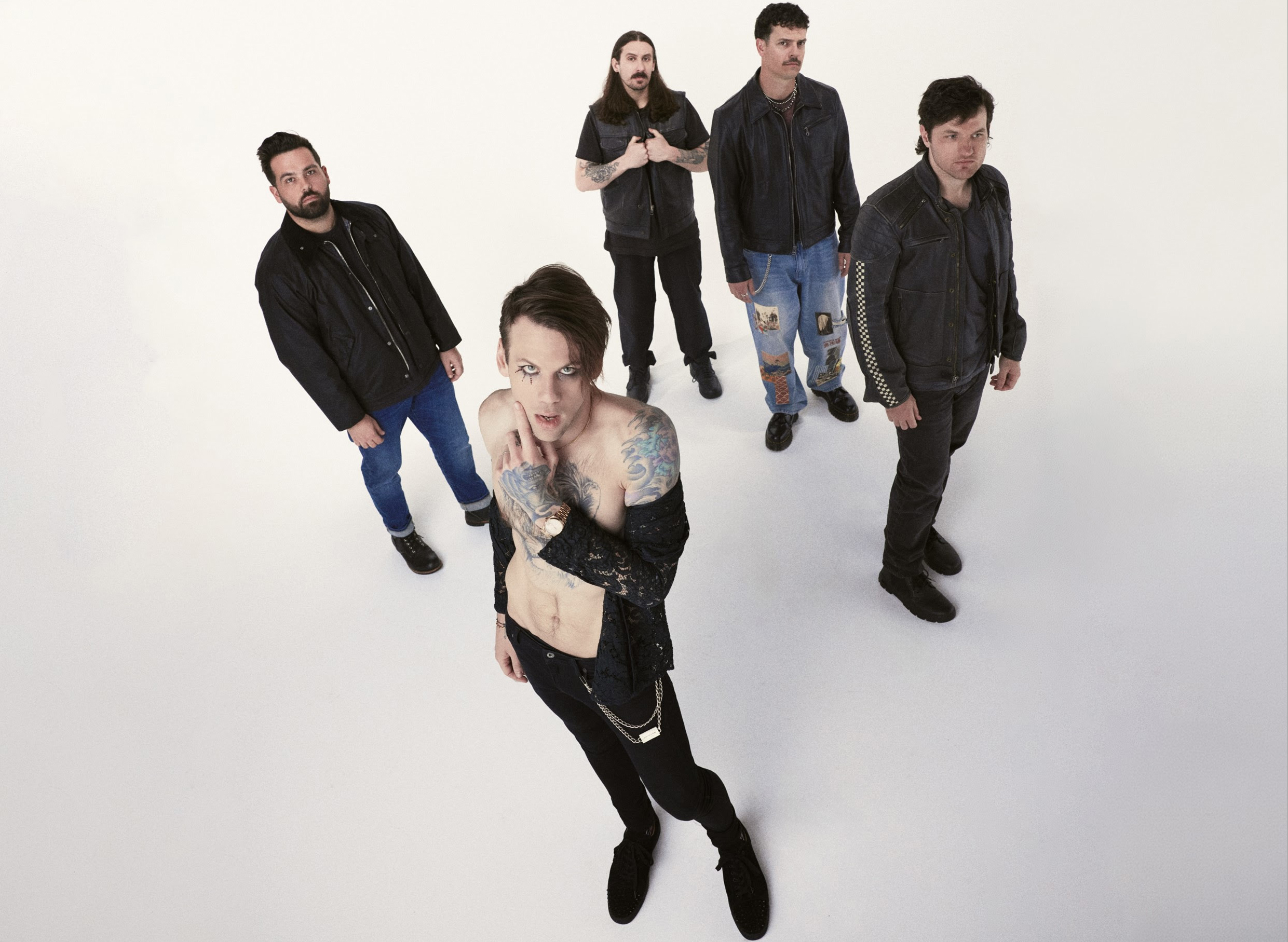 5 musicians photographed in white room