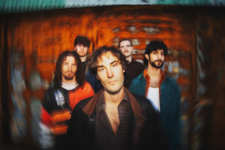 Five men photographed against colorful background