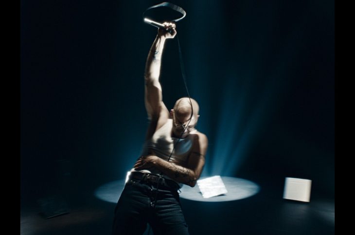 Man raising microphone into the air