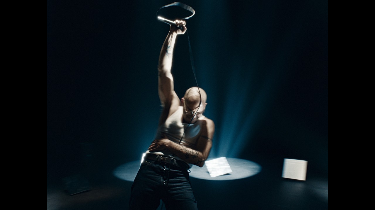 Man raising microphone into the air
