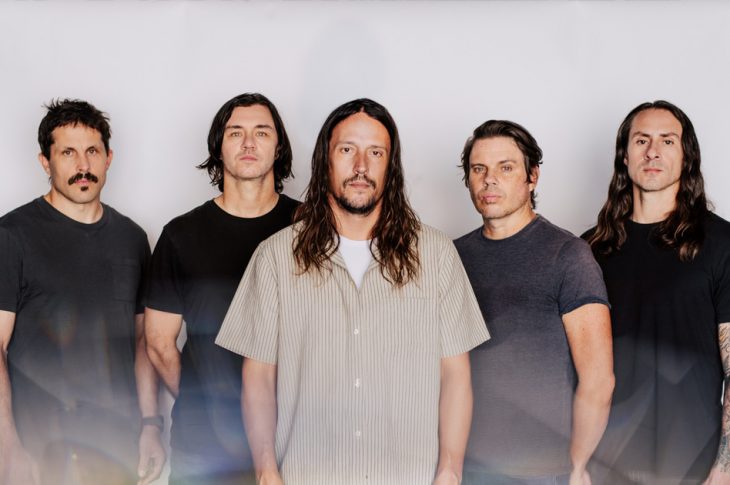 five men photographed against white background