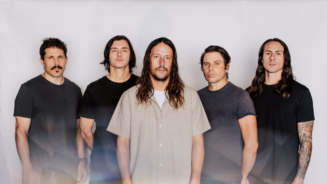 five men photographed against white background