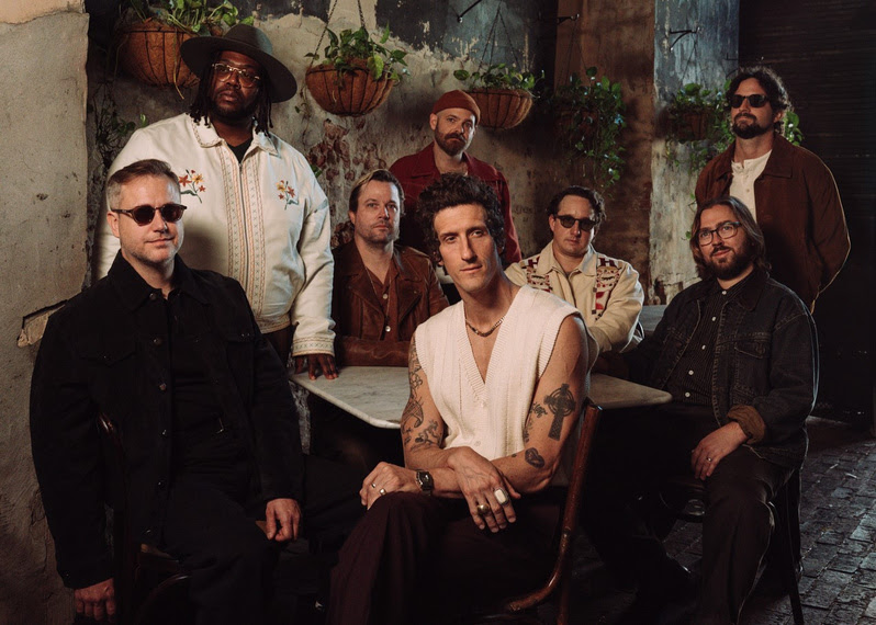 Photo of 8 people sittting at table