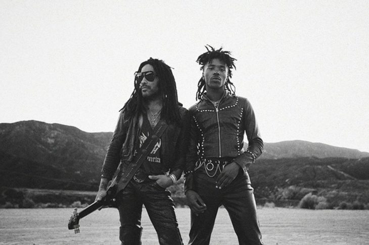 Black and white photo of two men standing in the desert.