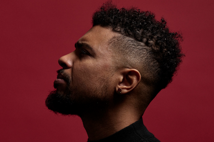 photo of man's profile against red background