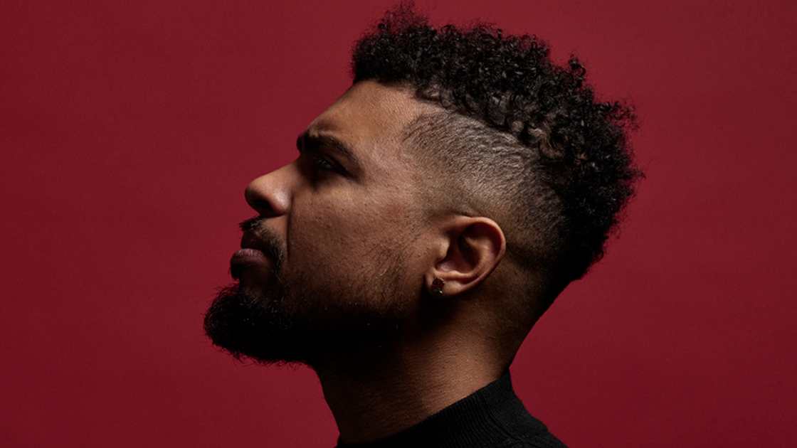 photo of man's profile against red background