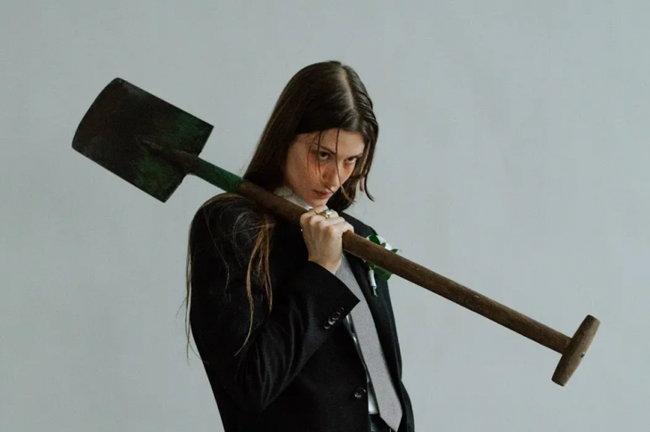 Photo of woman holding shovel