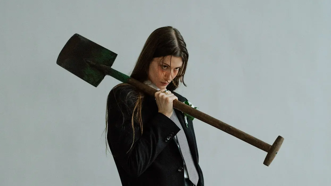 Photo of woman holding shovel