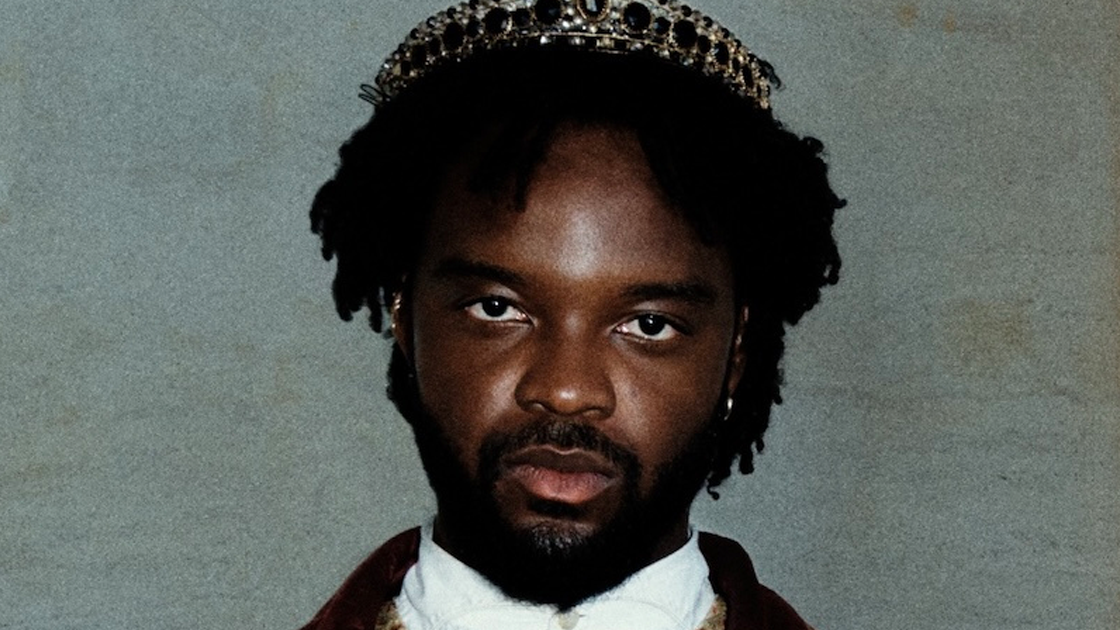 photo of man wearing crown