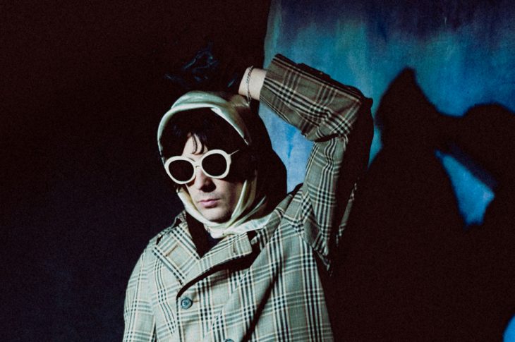 Photo of man in coat and sunglasses
